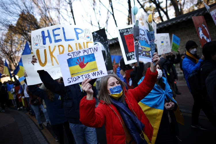 Ukrainian people march toward the Russian embassy during a protest against the massive military operation by Russia against Ukraine, in Seoul, South Korea on February 27 2022.