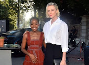 Thuso Mbedu and Charlize Theron.