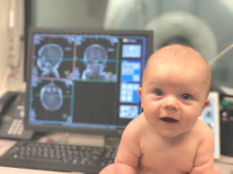 A baby in front of a computer

Description automatically generated