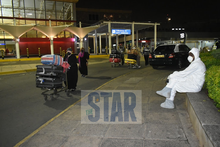 Kenyans who were stranded in India arrive at JKIA on May 7, 2020/ANDREW KASUKU