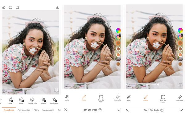 Foto de uma mulher negra sorrindo, deitada na grama e segurando uma flor, sendo editada pelo AirBrush