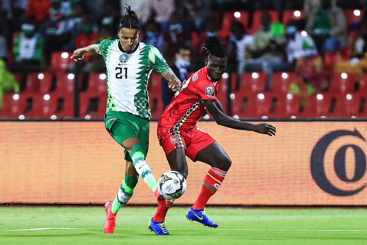 Nigeria's defender Tyronne Ebuehi (L) fights for the ball with Guinea-Bissau's forward Piqueti at Stade Roumde Adjia in Garoua on January 19