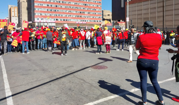 Chanting and holding placards, clad in red and black Samwu T-shirts, workers have closed Sauer Street close to Luthuli House.