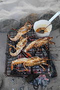 Whole braaiied crayfish with kapokbos butter.