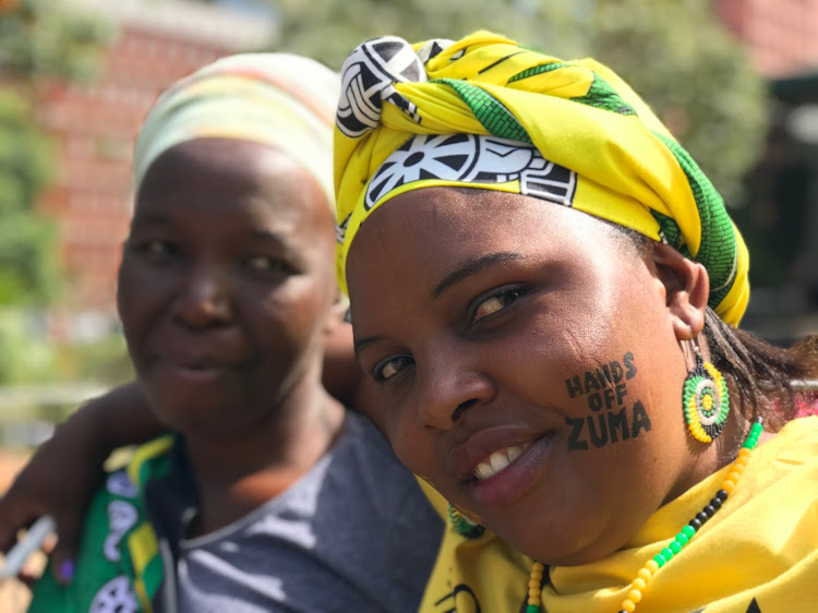 Fike Mthalane and Nelisiwe Ntuli outside the Pietermaritzburg High Court on Friday. They say they won’t stop supporting former president Jacob Zuma because he’s an innocent man. Zuma is facing corruption charges.