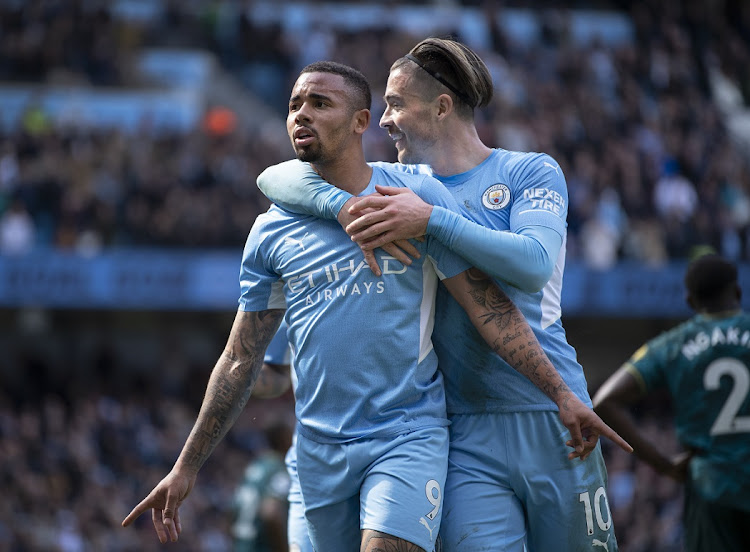 Gabriel Jesus of Manchester City celebrates scoring his second goal of four with teammate Jack Grealish in the Premier League match against Watford at Etihad Stadium in Manchester on April 23 2022.