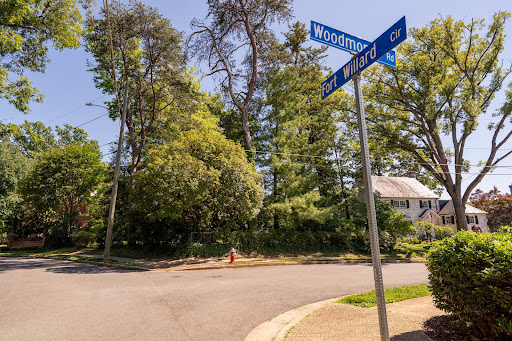 tree-lined intersection with houses and street signs in this luxury property for sale in Alexandria ($1,350,000)
