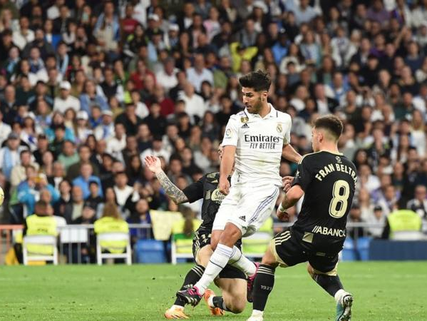 Marco Asensio (C) scores against Ceta Vigo