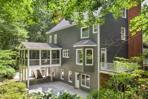 Grey house with screened porch and balcony in this luxury property for sale in Milton ($985,000)