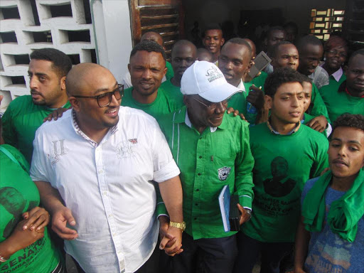 Mombasa Senator hopeful and Ford Kenya secretary general Yasser Bajaber and Kakamega Senator Boni Khalwale are welcomed by university student leaders in Mombasa at the Khamis High School on Saturday /BRIAN OTIENO