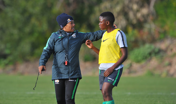 Banyana Banyana head coach Desiree Ellis (L) in a discussion with her Australia-based striker Rhoda Mulaudzi (R) during a training session at Agia Napa Fields in Cyprus on February 25 2019.