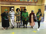 Minister of Tourism Lindiwe Sisulu addressing members of public after being handed over an artwork of her mother, Albertina Sisulu. The painting was done by Mpho Ngwenya (on her right), a Soweto born artist.