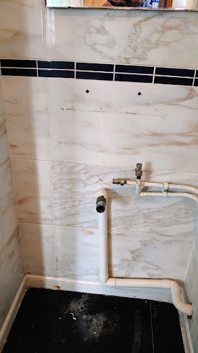 Removal of Old water-damaged vanity & basin 