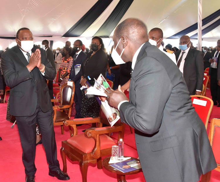 President Uhuru Kenyatta and his deputy William Ruto at the funeral service of Mzee Simeon Nyachae at Gusii Stadium, Kisii County on February 15, 2021.