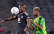 Zakhele Lepasa of Orlando Pirates is challenged by Tshepo Gumede of Marumo Gallants in the DStv Premiership match at Orlando Stadium on August 24 2022.