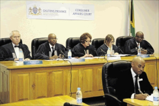 IN SESSION: Consumer Court members are, from left, Advocate Paul Hlahane, Professor Jannie Rossouw, consumer journalist Philippina Opperman, Advocate Tshepo Lebeko and the court's clerk in front PHOTO: supplied