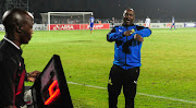 Mamelodi Sundowns' head coach Pitso Mosimane calls for the fourth match official to check his time during the Absa Premiership game against Maritzburg United at Harry Gwala Stadium in Pietermaritzburg on 25 April 2018.