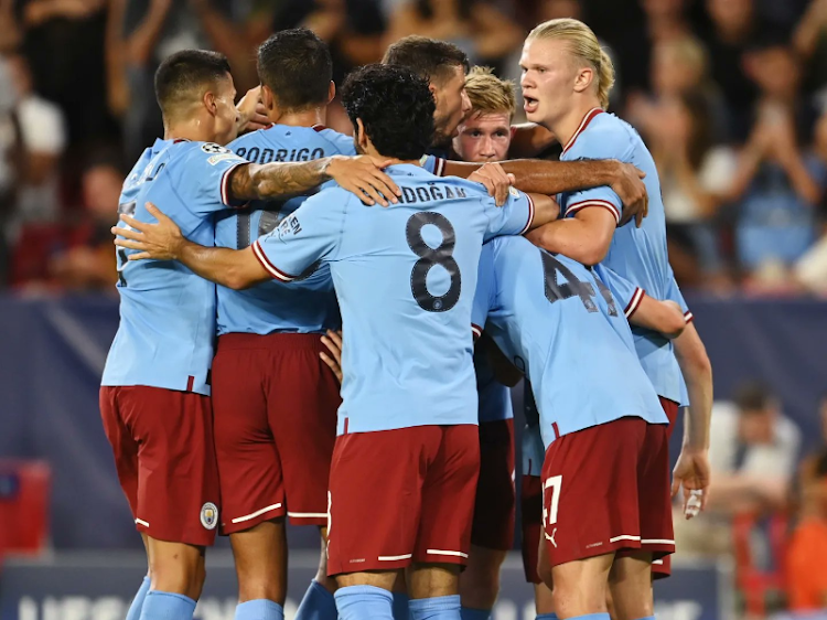 Manchester City players celebrate during a past match a