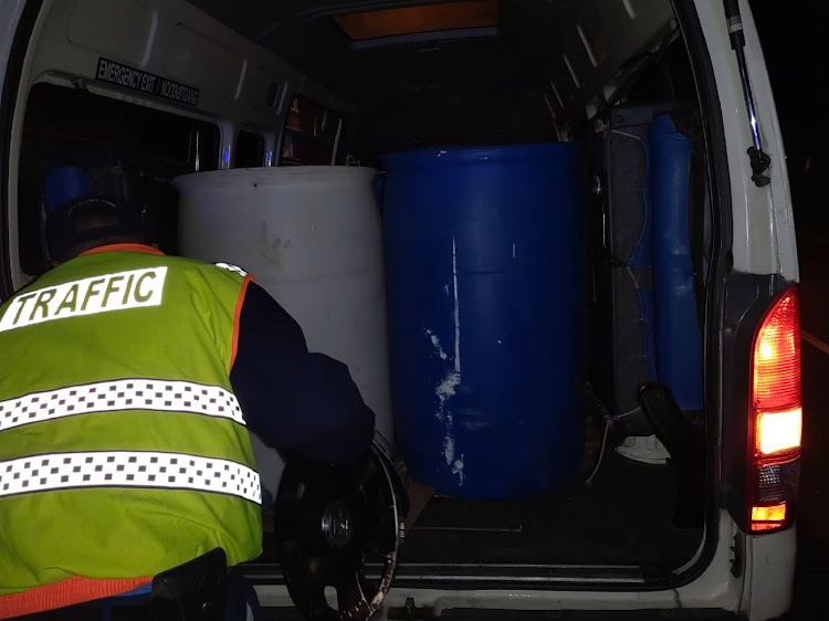 Containers packed into the Toyota Quantum.