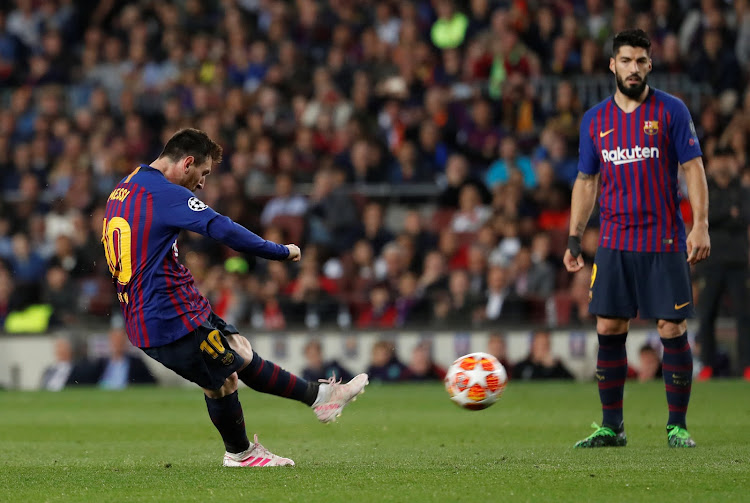 Barcelona's Lionel Messi takes a free-kick against Liverpool