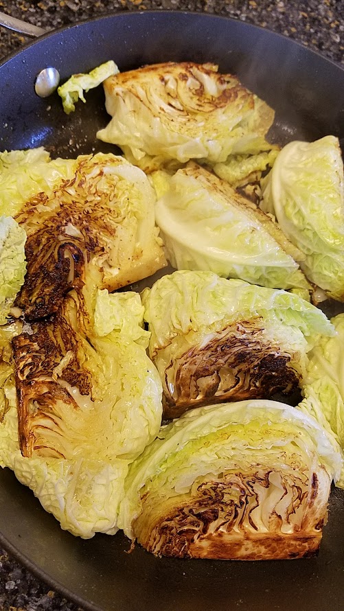 Cabbage getting browned in the pan for a Creamed Cabbage Recipe