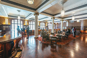 The Rand Club's sweeping wooden bar still holds the accolade of the longest bar in Africa.