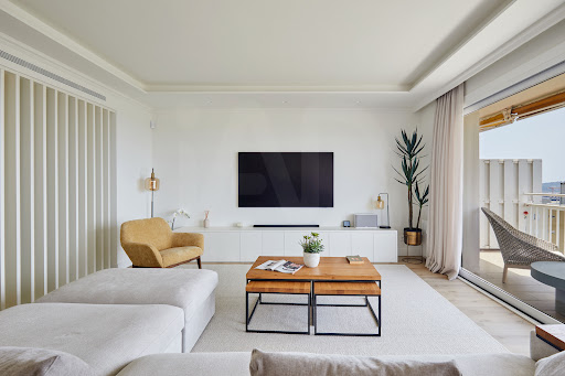 Modern living room with sofa and yellow armchair - Luxury apartment / penthouse for sale in Barcelona, 4 rooms, 4 bedrooms