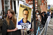 Protesters demonstrate in support of jailed Russian opposition politician Alexei Navalny outside the Russian Embassy in London, Britain, on April 21 2021. 