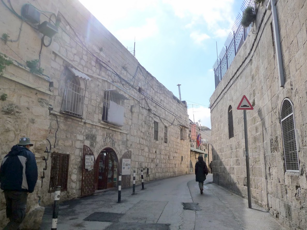 Travel to Israel - Jerusalem. Walking through the Armenian Quarter, one of the four neighborhoods comprising the Old City. You can't see most of it, just this one street alongside its walls