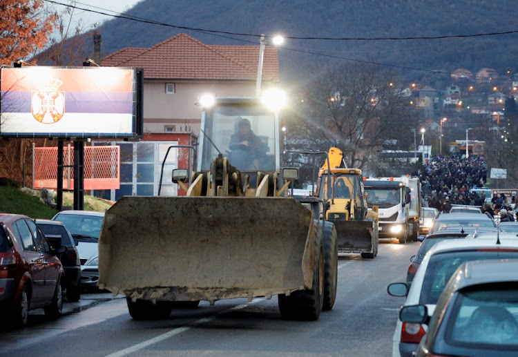 Kosovo Serbs block the road near the village of Rudine, Kosovo, December 10 2022. Picture: OGNEN TEOFILOVSKI/REUTERS