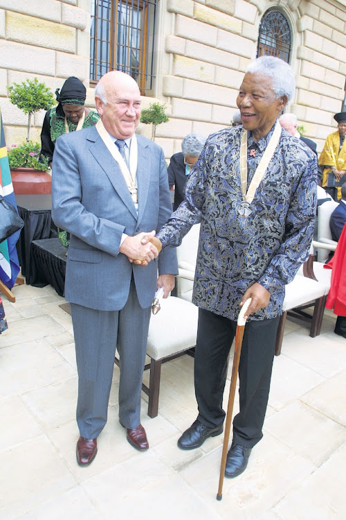 Two former presidents, FW de Klerk and Nelson Mandela at the Union Buildings in Pretoria, to receive an award from President Thabo Mbeki in December 2002.