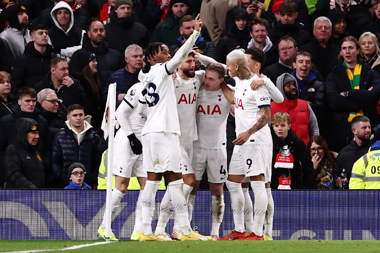 Rodrigo Bentancur of Tottenham Hotspur celebrates with teammates Destiny Udogie, Oliver Skipp and Richarlison after scoring their team's second goal during the Premier League match against Manchester United at Old Trafford on January 14, 2024 in Manchester, England.