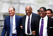 Actor and comedian Bill Cosby leaves with his spokesman Andrew Wyatt (R) and lawyer Brian McMonagle after the second day of his sexual assault trial at the Montgomery County Courthouse in Norristown, Pennsylvania, U.S. June 6, 2017.