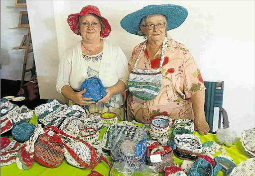 Pensioner Wendy Lieberum, right, and her daughter Jennifer Lieberum sold hand-crafted bags, hats and slippers which Wendy crocheted from old supermarket bags at the Big Green Expo at Vincent Park at the weekend Picture: BARBARA HOLLANDS