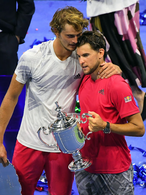 Dominic Thiem of Austria (R) and Germany's Alexander Zverev after receiving their trophies at the U.S. Open tennis tournament.