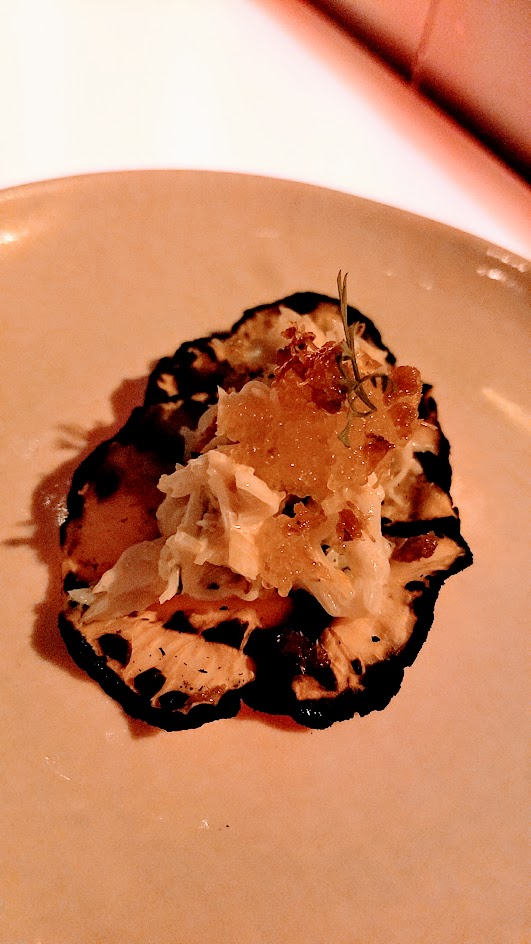 Superbite Happy Hour item of Dungeness Crab with celery root tortilla, sesame mayo, citrus, and tobiko