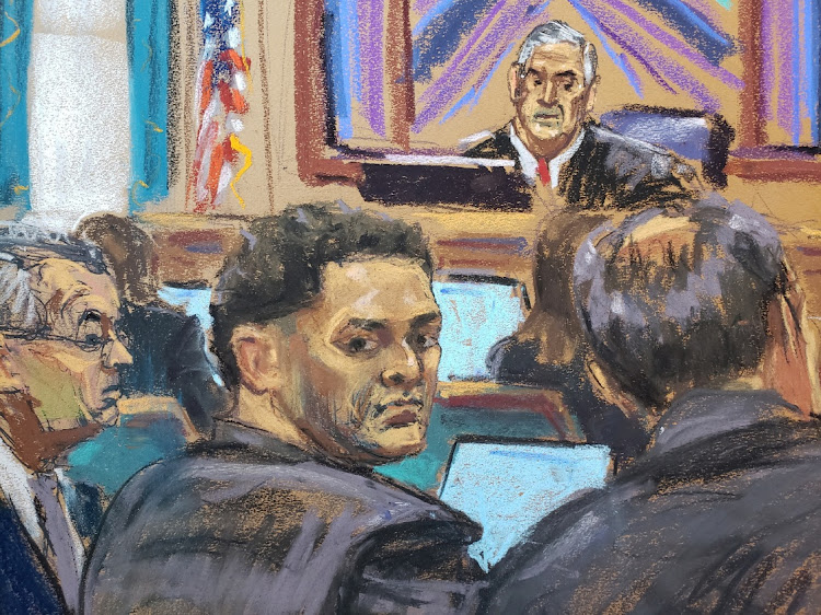 Sam Bankman-Fried sits beside his defence lawyer Christian Everdell on the first day of his fraud trial in New York, the US, October 3 2023, in this courtroom sketch. Picture: JANE ROSENBERG/REUTERS