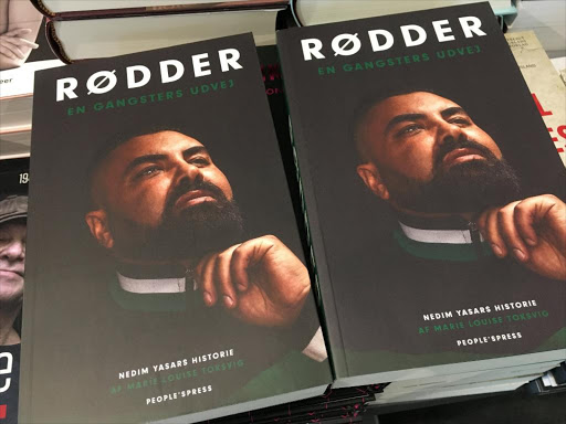 Nedim Yasar's books "Roots - a gangster's exit" are displayed in a bookstore in Copenhagen, Denmark November 20, 2018. /REUTERS