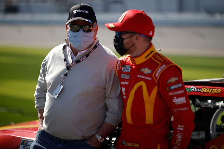 Team owner Chip Ganassi and Ross Chastain, driver of the #42 McDonald's Chevrolet, at Daytona International Speedway on February 21 2021. Ganassi was penalised for allowing a 'non-essential individual' into a restricted area.