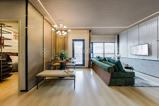 Modern living room with green sofa and dining area in this luxury apartment / penthouse for sale in Khlong Toei ($215,036)
