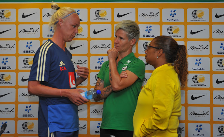 Sweden senior women's national team Caroline Seger (L) in a discussion with Banyana Banyana coach Desiree Ellis (R) and captain Janine Van Wyk (R) after the game at the Cape Town Stadium on January 21 2019.