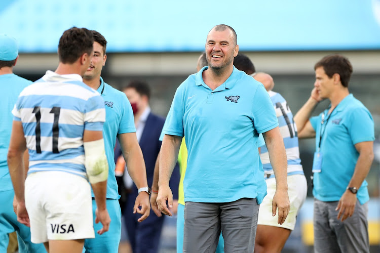 Former Wallabies coach Michael Cheika, now with Argentina, celebrates with Juan Imhoff of the Pumas after winning the Tri-Nations rugby match against the New Zealand All Blacks at Bankwest Stadium on November 14, 2020 in Sydney