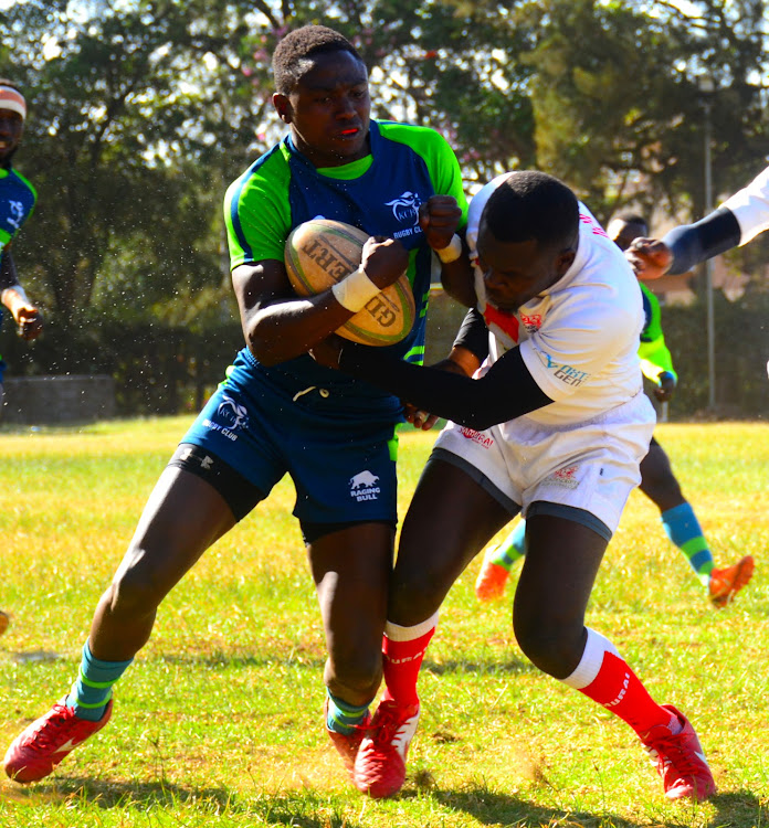 KCB's Samuel Asati (L) in battle with Moses Begi of Nondies during a recent Kenya Cup clash