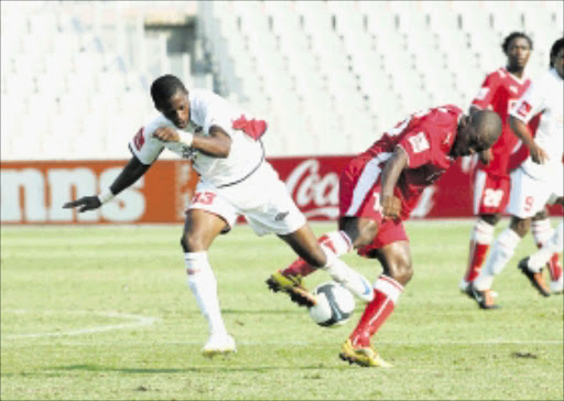 Twirl: Platinum Stars' Almiro Lobo battles Sifiso Thomo of Free State Stars for ball possession in their Absa Premiership match at Moruleng Stadium. Pic: VELI NHLAPO. 10/02/2010. © Sowetan. 2010014VNH. Almiro Lobo of Platinum Stars fight for the ball with Sifiso Thomo of Free State Stars during thier Absa Premiership match at Moruleng Stadium.PHOTO:VELI NHLAPO.