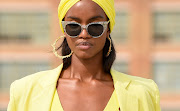 Match your head wrap to your outfit for a trendy monochromatic look and leave out some wispy pieces of hair to frame the face.