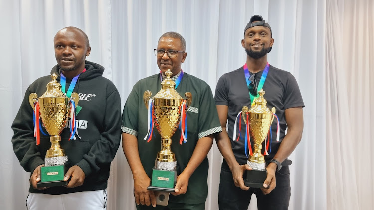 Patrick Nderitu Gitonga (centre) with Allan Oyende (L) and David Kimani (R) after sweeping the podium at ECASA championships in Gaborone, Botswana