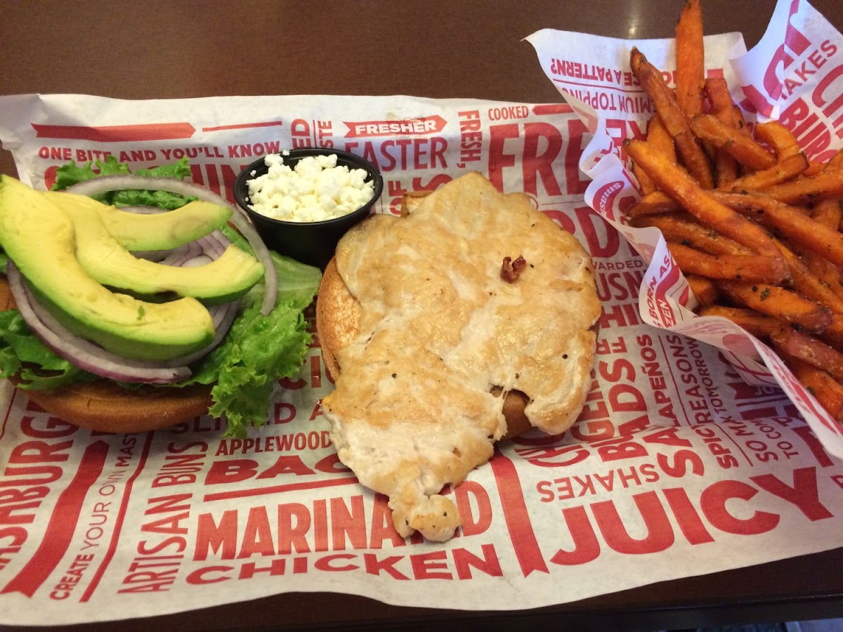 Smash chicken with avocado and onion on an Udi's GF bun. I got sweet potato smash fries as well, but