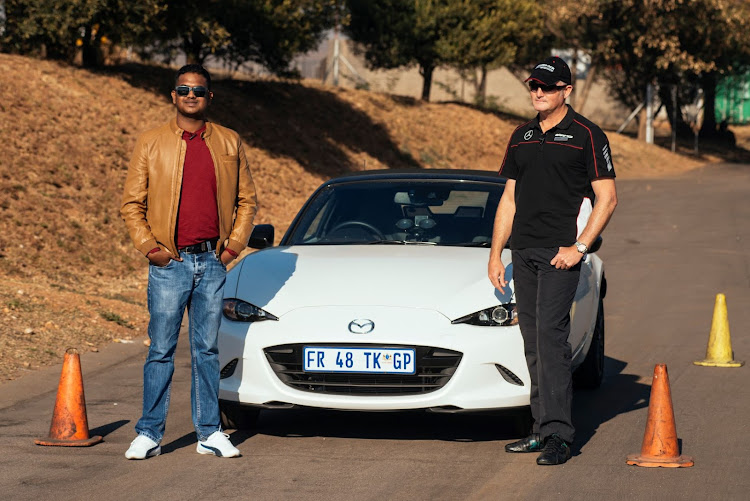 Author Brenwin Naidu (left) with Mercedes-Benz Dynamic Driving Academy head Clinton Weston.