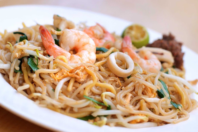 Singapore's signature dish of prawn noodles, called Hokkien mee.