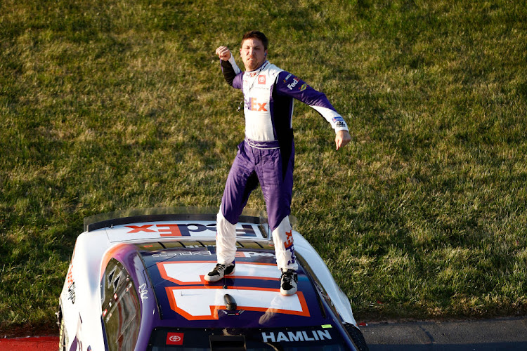 Denny Hamlin celebrates after winning the Nascar Cup Series Toyota Owners 400 at Richmond Raceway on April 03 2022 in Richmond, Virginia.